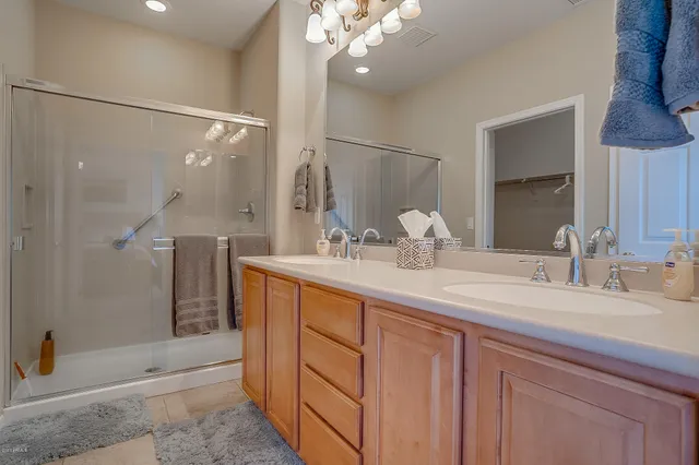 a bedroom with a bed and a lamp