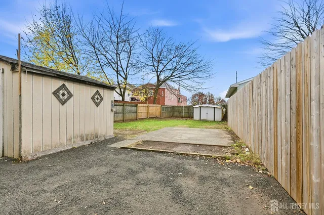a view of a backyard of the house