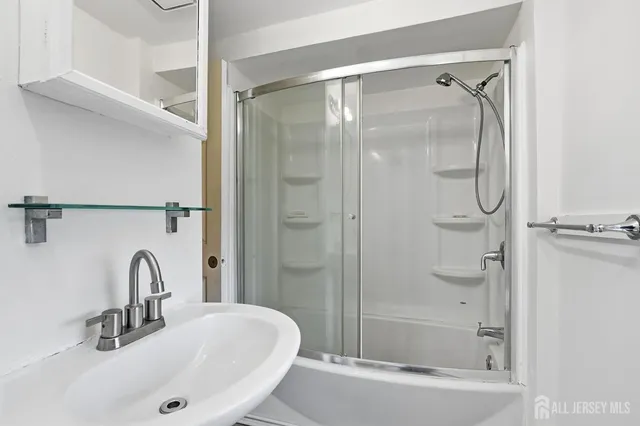 a bathroom with a sink and a shower