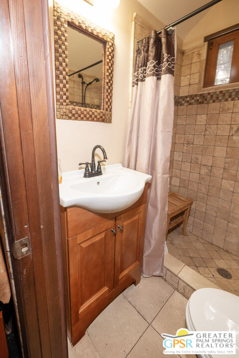 76 7 Oaks Road Angelus Oaks, CA 92305 - Photo 12 of 35 a bathroom with a sink a toilet and shower