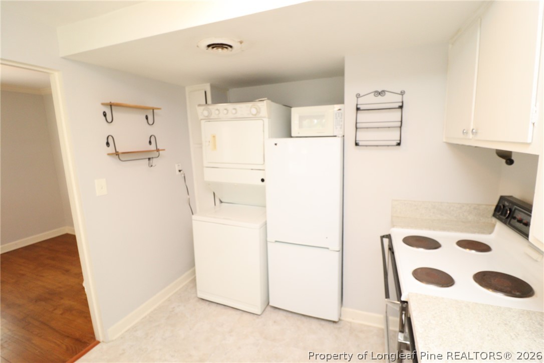1000 Nichols Drive Raleigh, NC 27605 - Photo 11 of 22 a white refrigerator freezer sitting inside of a kitchen