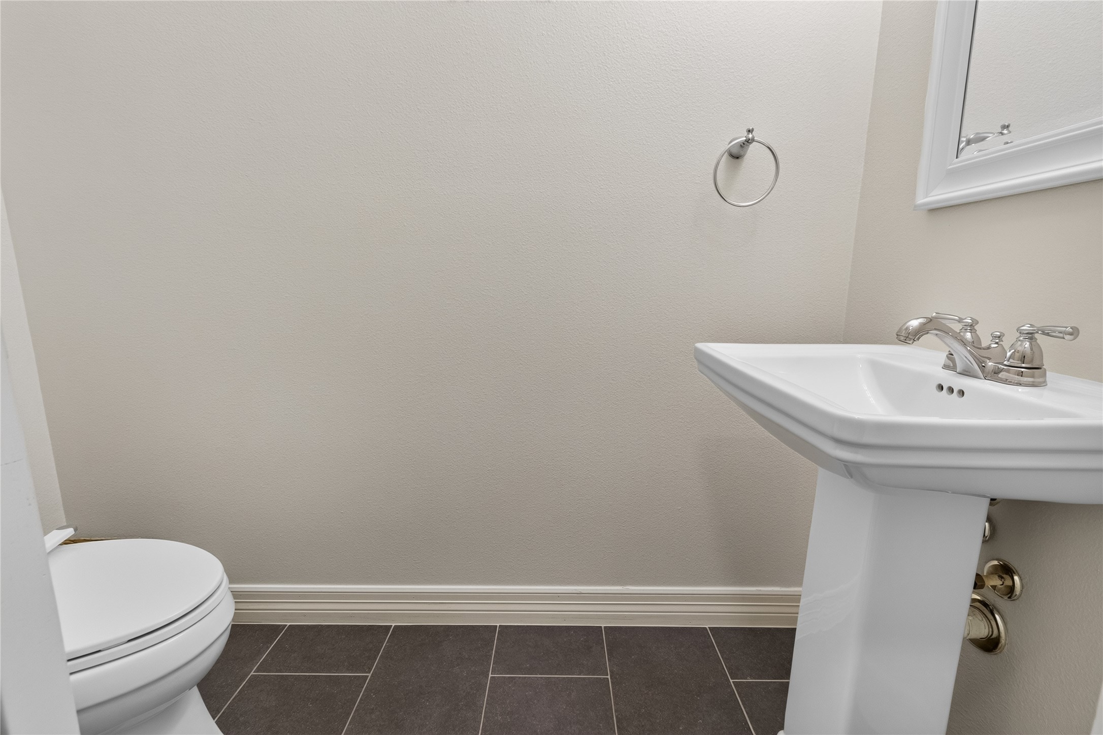 1722 Chippendale Road Houston, TX 77018 - Photo 16 of 41 Charming powder room featuring a sleek pedestal sink, modern fixtures, and elegant tile flooring for a clean, minimalist look.