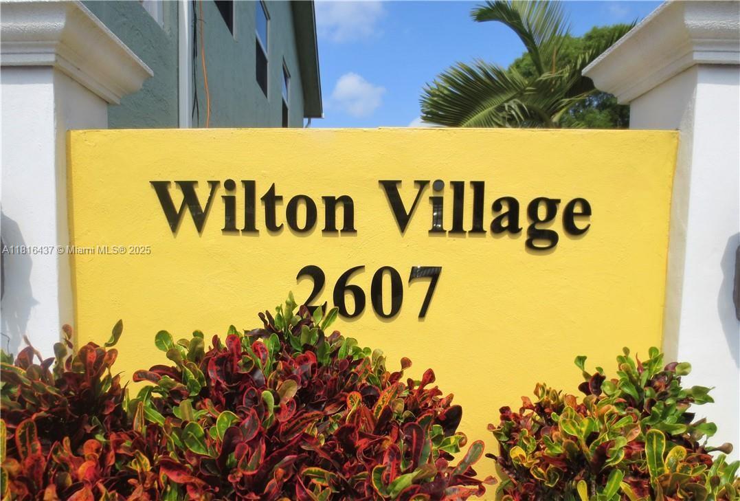 2607 Northeast 8th Avenue, Unit 19 Wilton Manors, FL 33334 - Photo 1 of 11 a sign that is on the side of a building