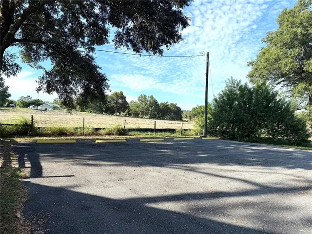a view of a yard with an outdoor space