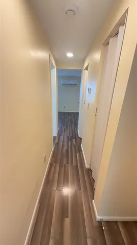 a view of gallery with wooden floor