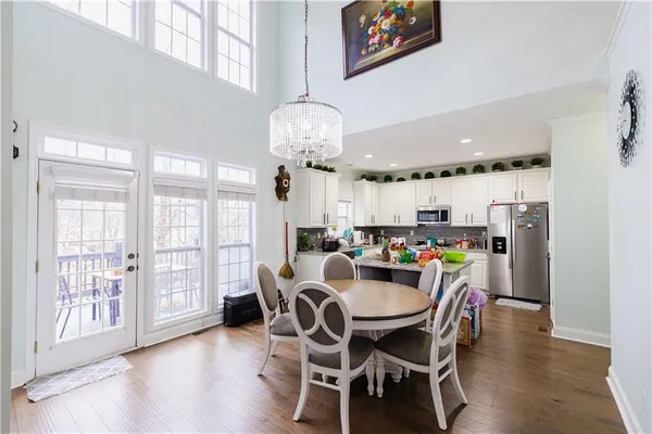 a dining room with furniture and window