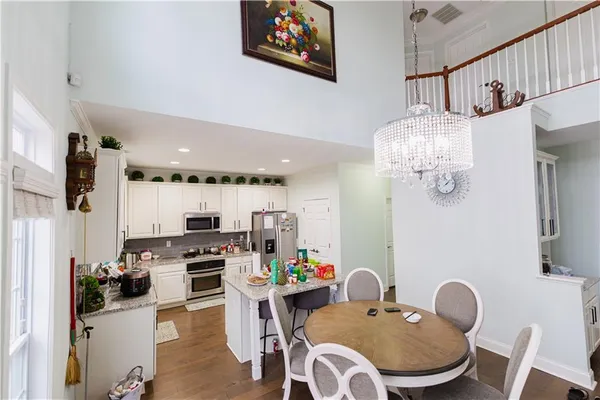 a very nice looking dining room with furniture