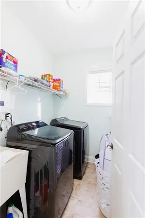 a utility room with dryer and washer
