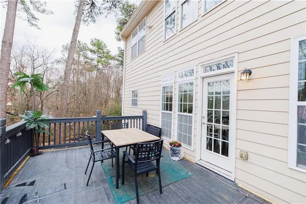 a view of a patio with a table and chairs