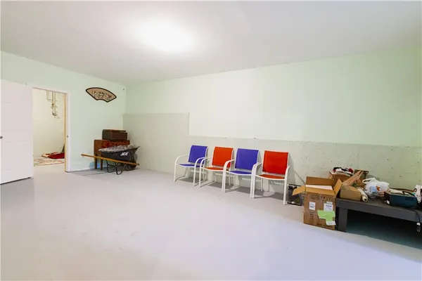 a living room with furniture and gym equipment