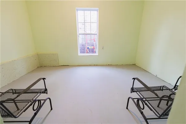 a view of an empty room with windows