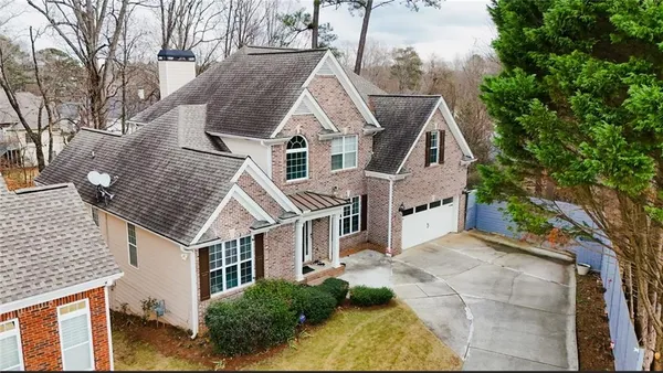 a aerial view of a house with a yard