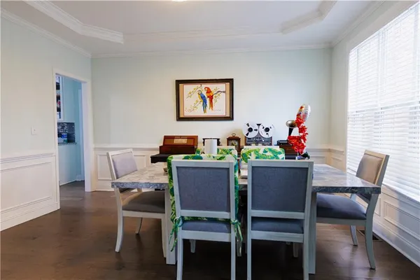 a view of a dining room with furniture and wooden floor