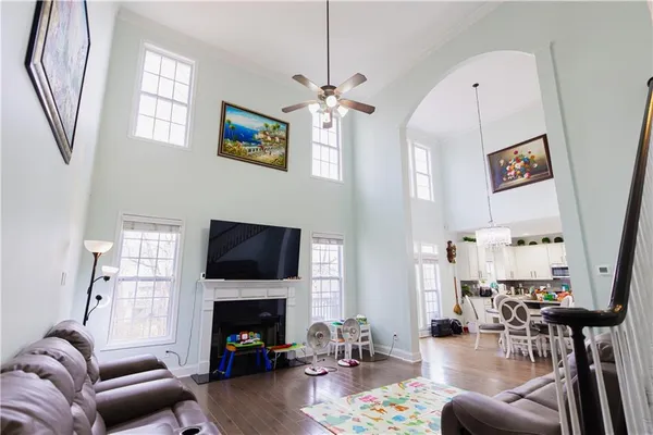 a living room with furniture fireplace and a window