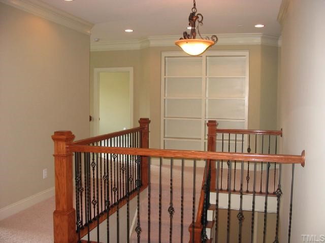 2820 Peachleaf Street Raleigh, NC 27614 - Photo 10 of 12 a view of a hallway with a chandelier