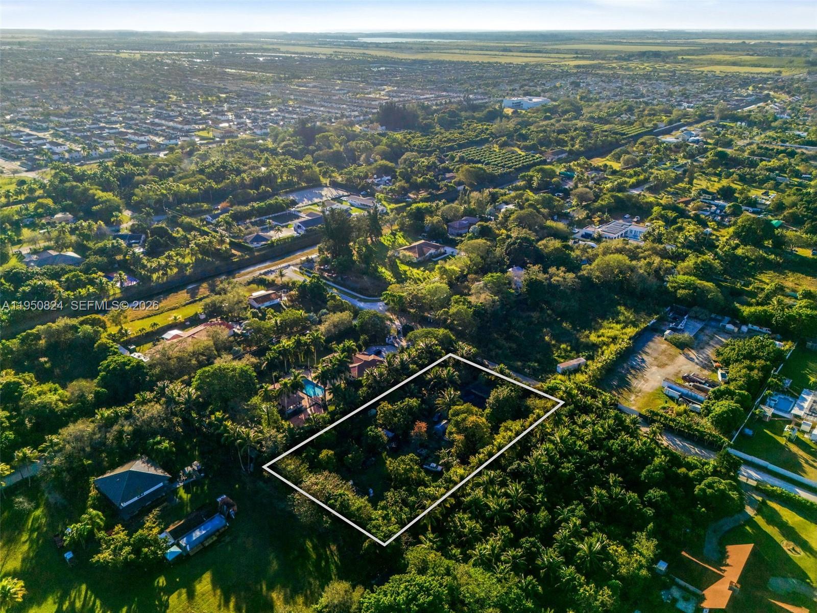 12325 Southwest 240th Street Homestead, FL 33032 - Photo 6 of 11 an aerial view of multiple house