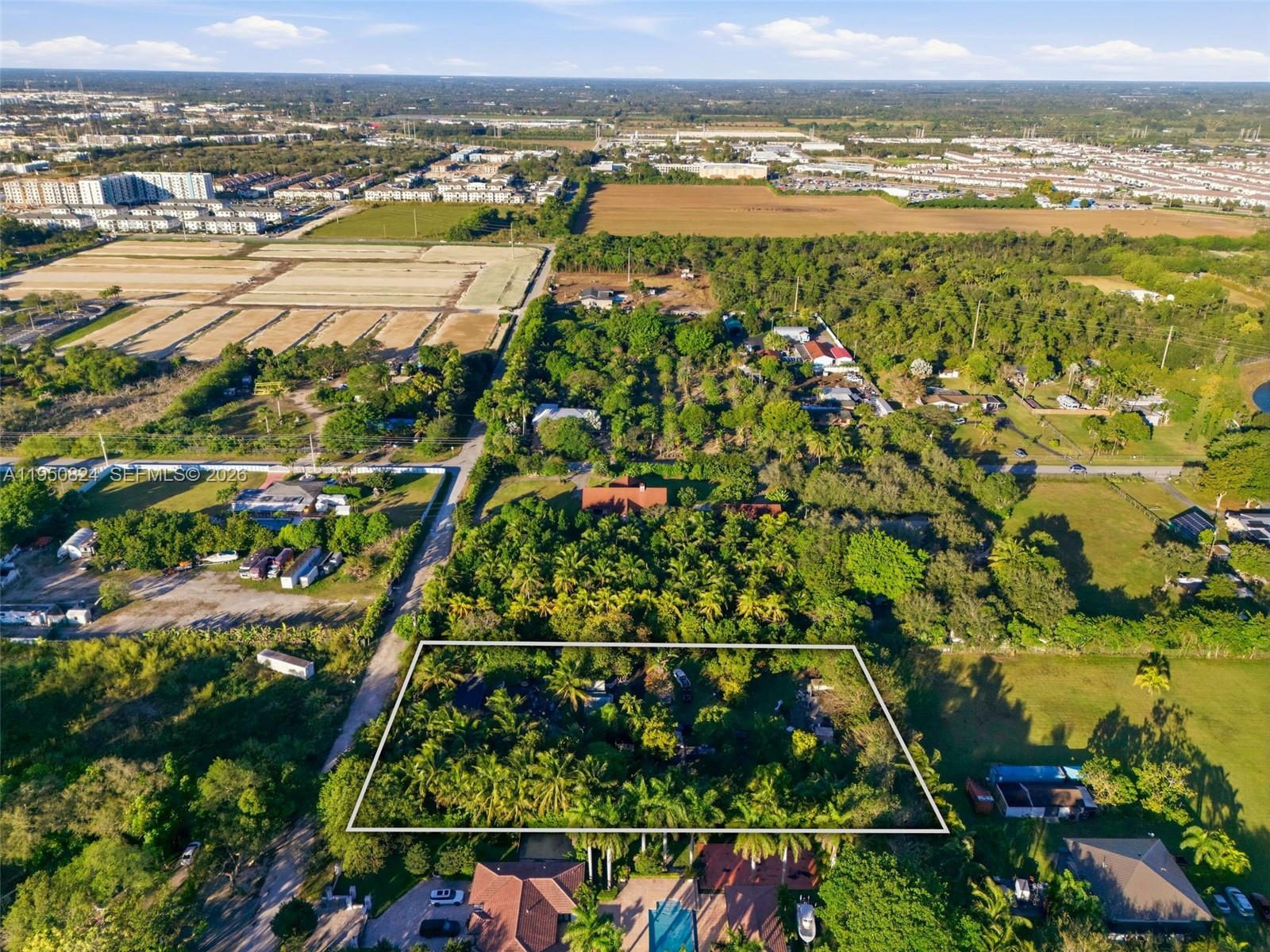 12325 Southwest 240th Street Homestead, FL 33032 - Photo 7 of 11 an aerial view of residential houses with outdoor space