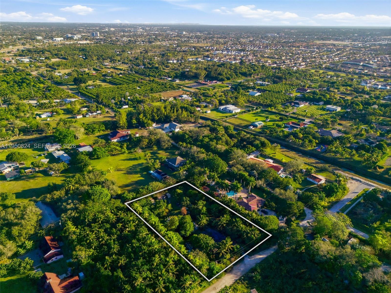 12325 Southwest 240th Street Homestead, FL 33032 - Photo 9 of 11 an aerial view of multiple house