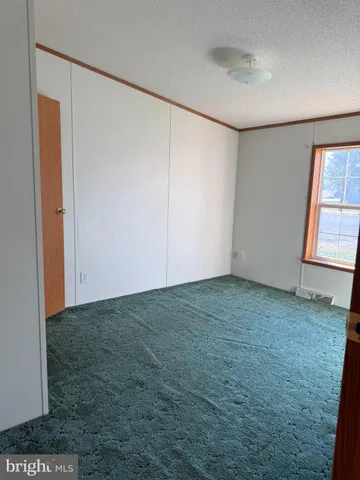 a view of a room that has a window in it