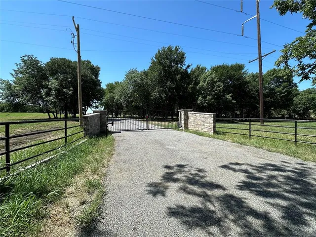 a view of park with wooden fence