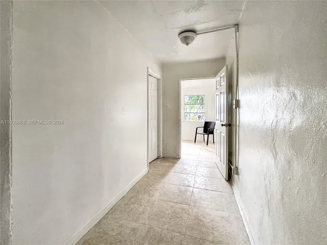 a view of a room with a hallway