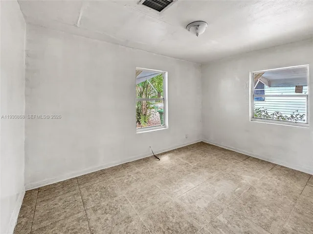 an empty room with windows