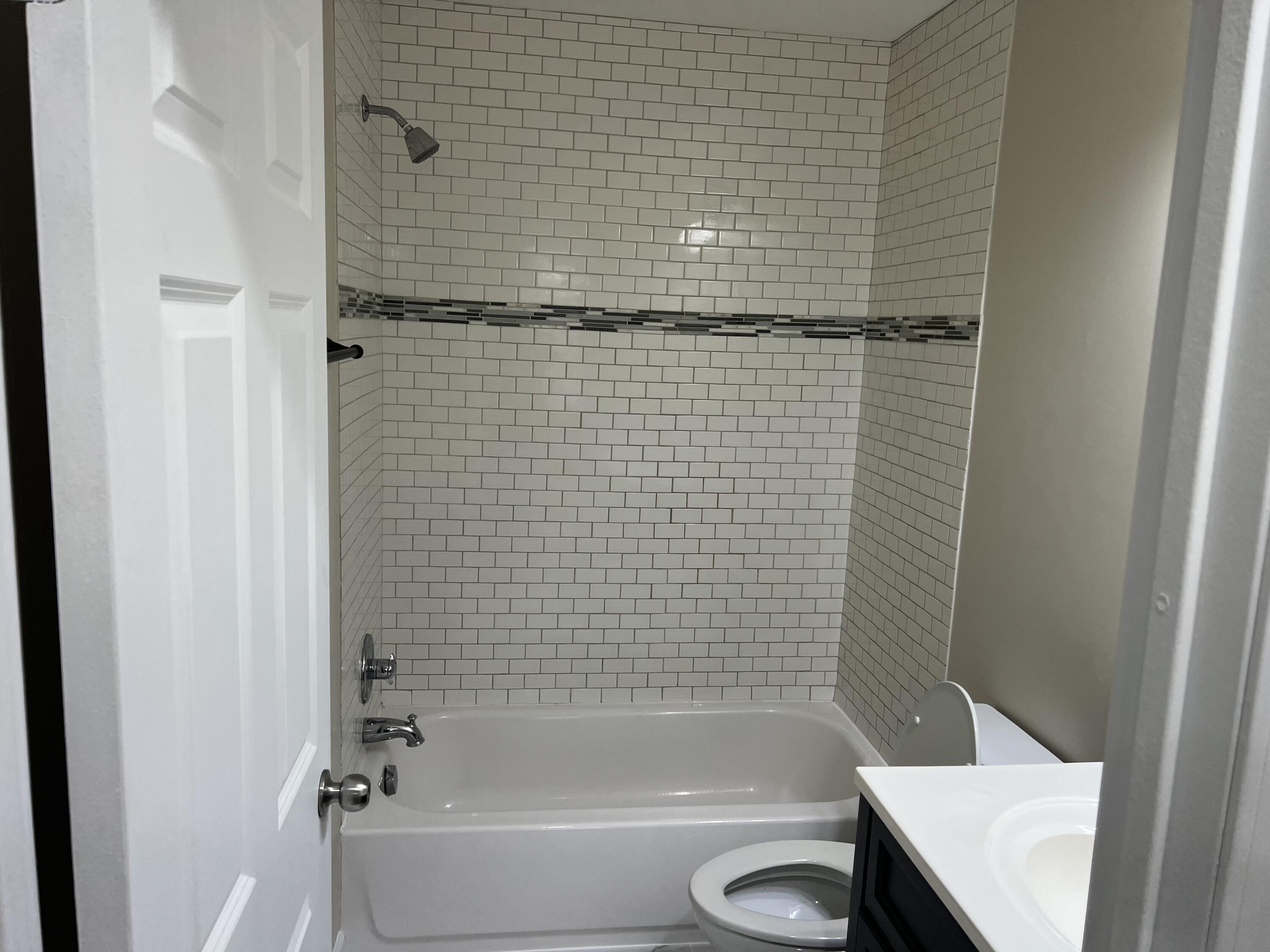 3851 Maple Street Hobart, IN 46342 - Photo 7 of 28 a bathroom with a shower and a toilet