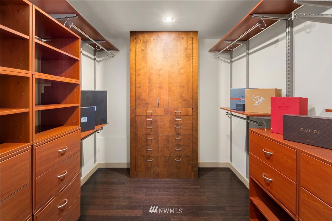 110 Northside Road Bellevue, WA 98004 - Photo 23 of 37 a view of walk in closet with clothes and shoes