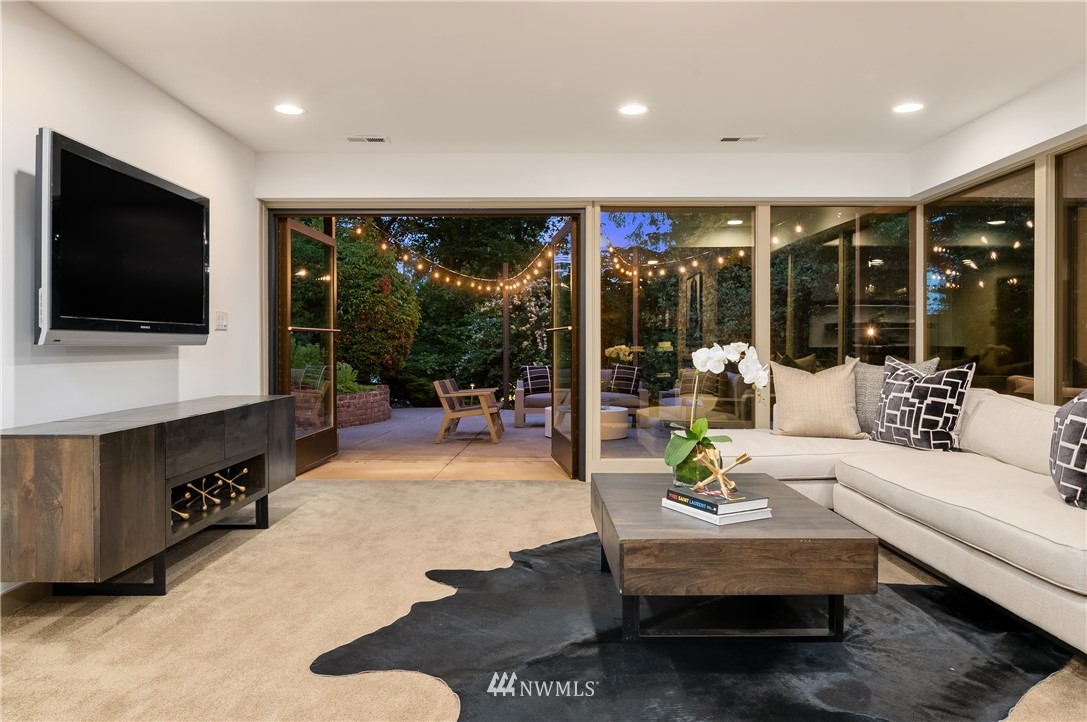 110 Northside Road Bellevue, WA 98004 - Photo 27 of 37 a living room with furniture a flat screen tv and a large window