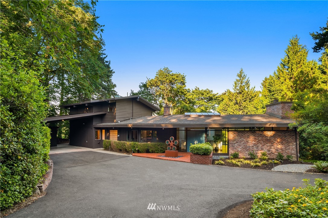 110 Northside Road Bellevue, WA 98004 - Photo 5 of 37 a front view of a house with a yard and garage