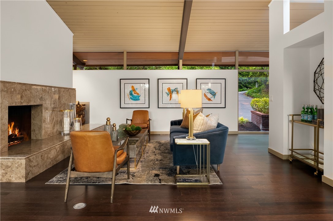 110 Northside Road Bellevue, WA 98004 - Photo 10 of 37 a living room with furniture wooden floor and a fireplace