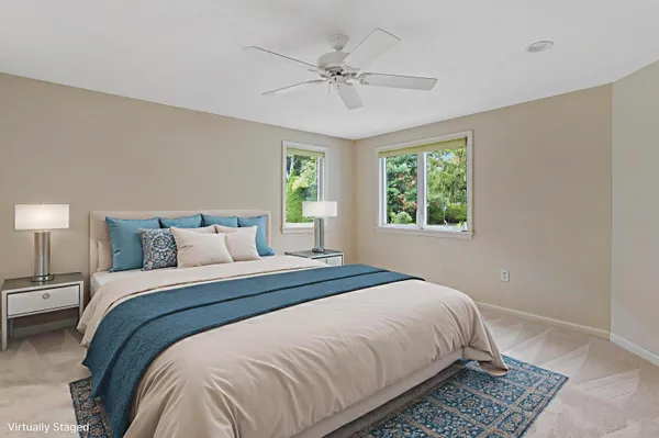 a bedroom with a bed and window