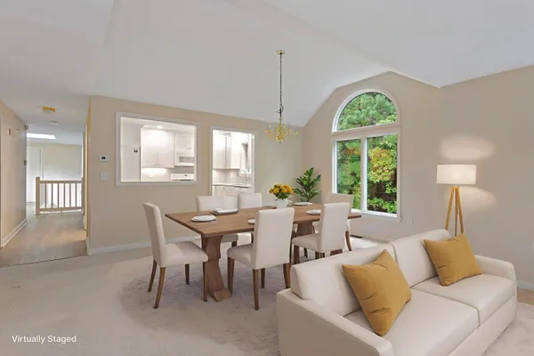 a view of a dining room with furniture and a window
