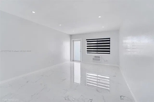 a view of empty room with stairs