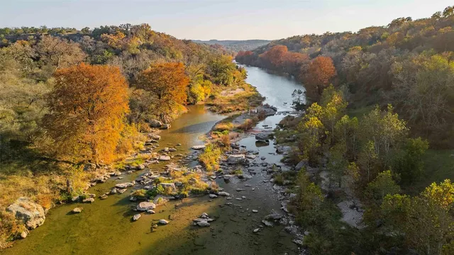 a view of a houses with a lush green hillside