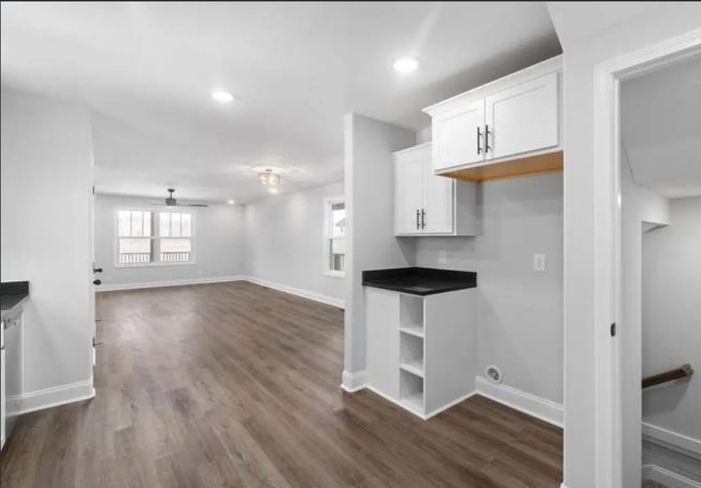 64 West High Street Clarksville, TN 37040 - Photo 18 of 18 wooden floor in an empty room with a window