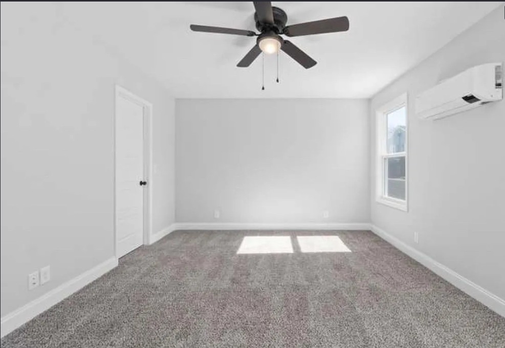 64 West High Street Clarksville, TN 37040 - Photo 7 of 18 an empty room with a window and a fan