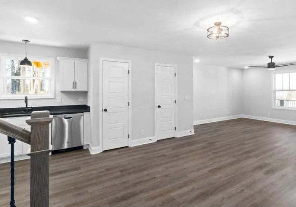 64 West High Street Clarksville, TN 37040 - Photo 8 of 18 a view of an empty room with wooden floor and a window