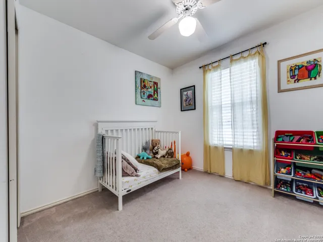 a white room with furniture and window