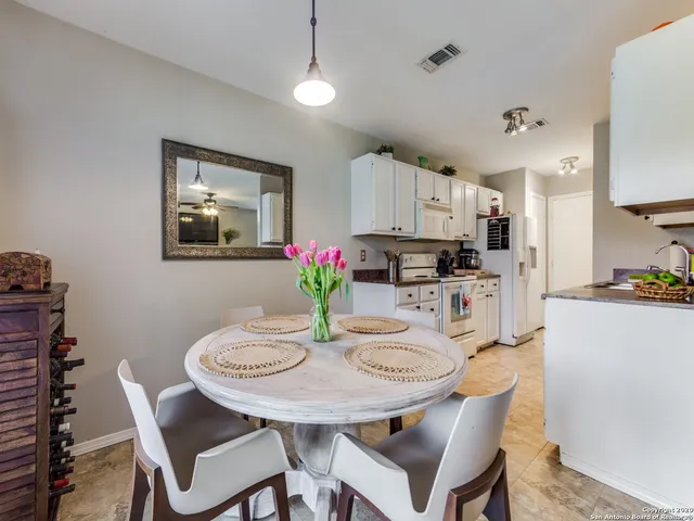 a dining room with furniture and window