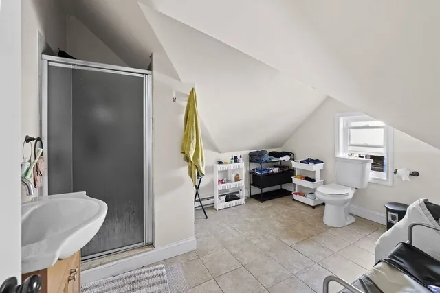 a living room with furniture and a lamp