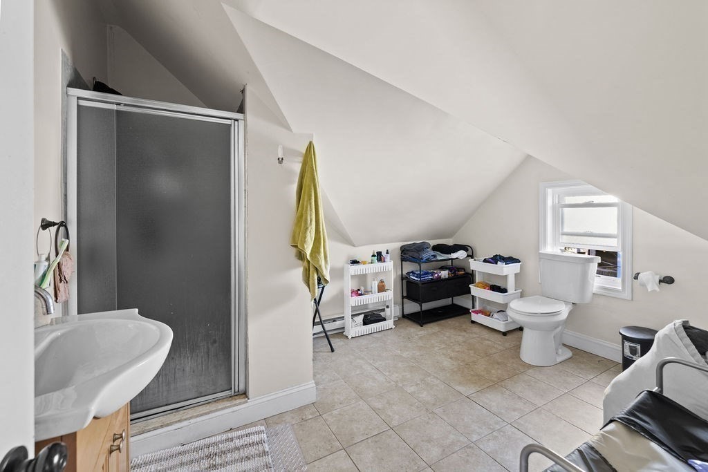 18 Holborn Street Boston, MA 02121 - Photo 20 of 33 a living room with furniture and a lamp