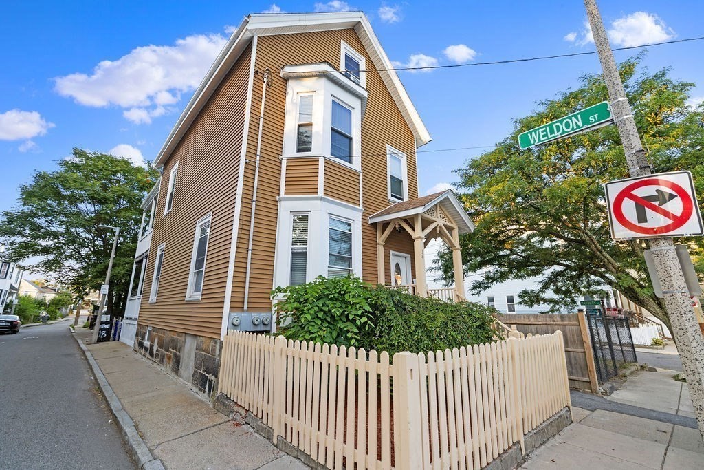 18 Holborn Street Boston, MA 02121 - Photo 2 of 33 a front view of a house with a tree