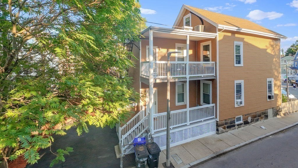 18 Holborn Street Boston, MA 02121 - Photo 25 of 33 a front view of a house with a yard