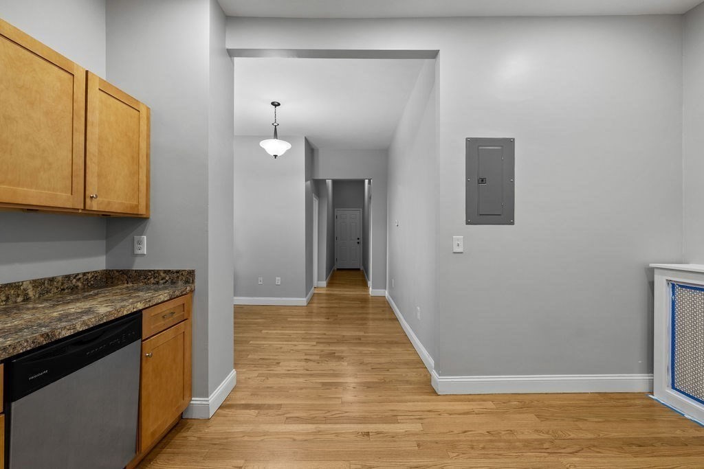 18 Holborn Street Boston, MA 02121 - Photo 7 of 33 a view of a kitchen from the hallway
