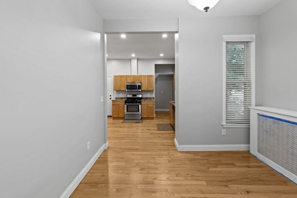 18 Holborn Street Boston, MA 02121 - Photo 8 of 33 a view of kitchen with refrigerator and window