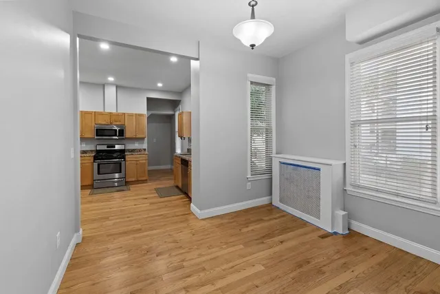 a view of kitchen with kitchen island microwave and stove