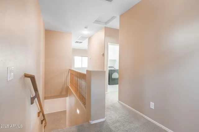 a kitchen with a sink a refrigerator and cabinets