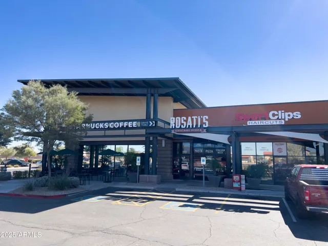 a front view of a house with parking space