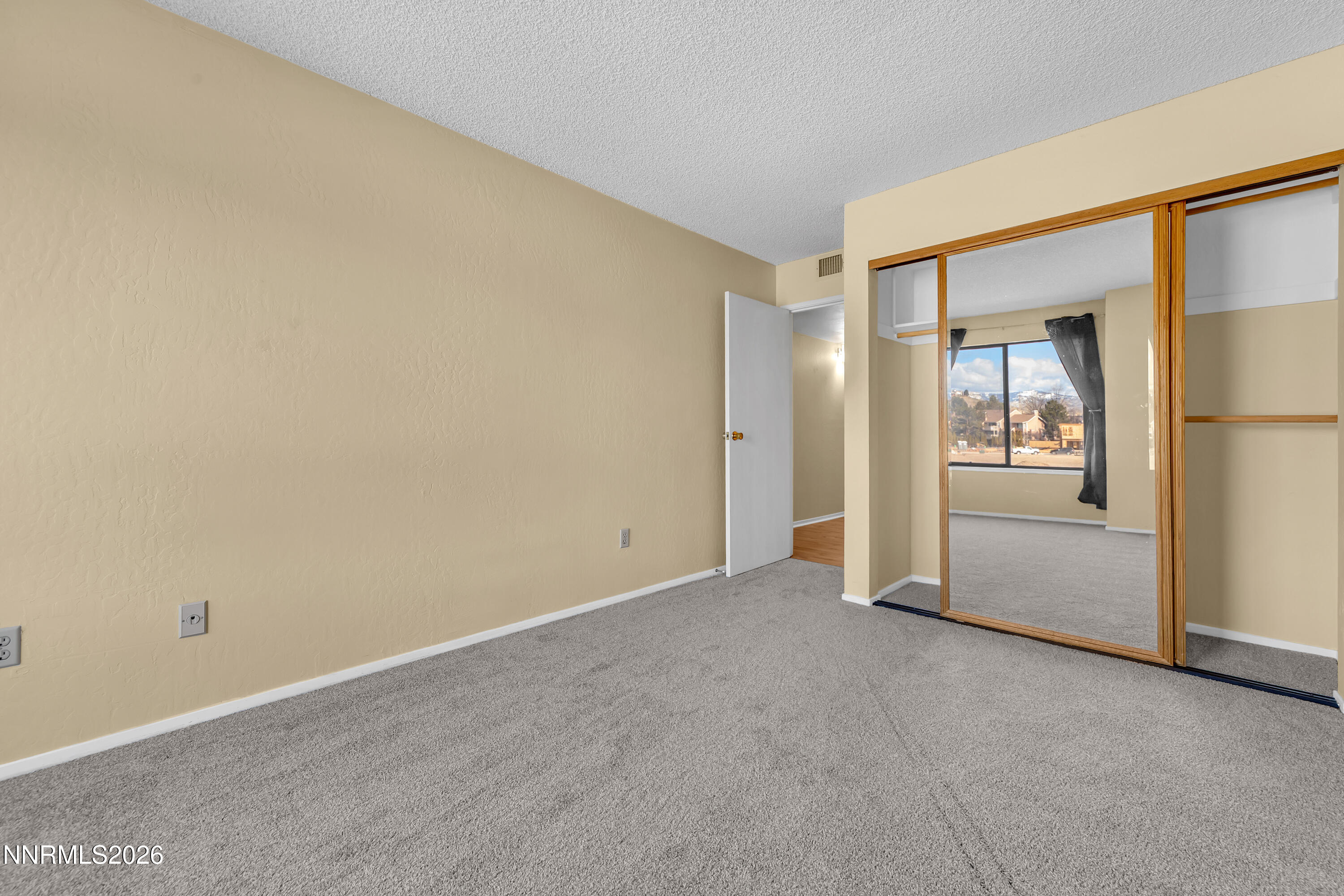 2845 Idlewild Drive, Unit 204 Reno, NV 89509 - Photo 12 of 29 an empty room with windows